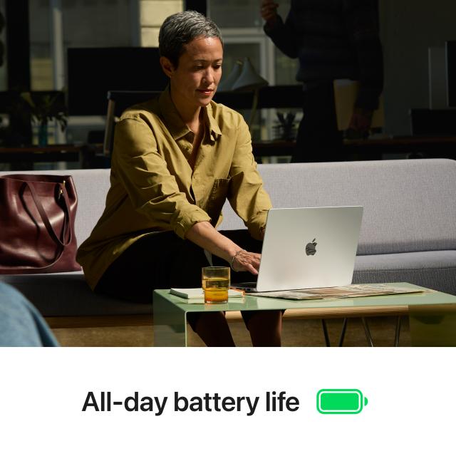 Seated person using MacBook Pro in a public location. Below text reads "All-day battery life"